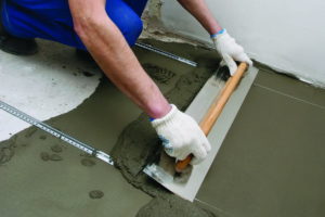 Как правильно выровнять бетонный пол?